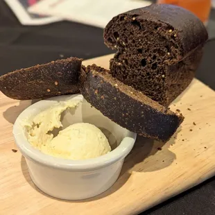 Homemade complementary load of bread and honey butter.