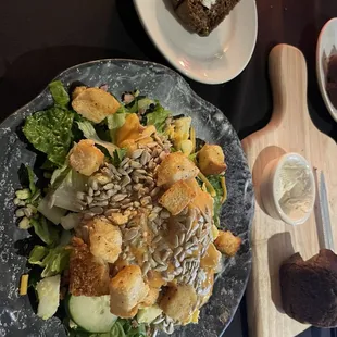 A salad with different items from the salad bar