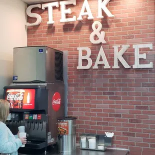 a woman standing in front of a counter
