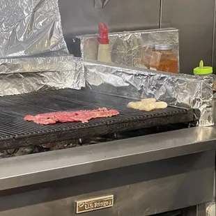 steak and scallops on the grill