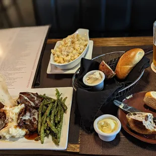 a plate of food and a glass of beer