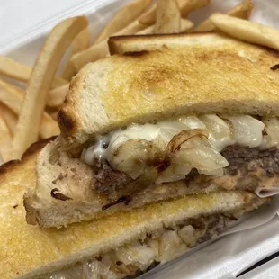 a grilled cheese sandwich and french fries