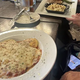 Ravioli and pork chop with asparagus and Mac n cheese