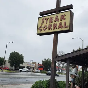 a man standing in front of a restaurant