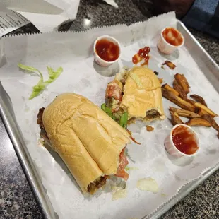 a sub sandwich and fries