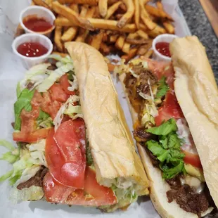 two subs and french fries