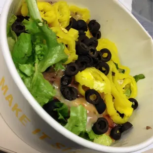 Salad topped with steak