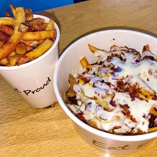 A small cup of French Fries, along side a large bowl of "Loaded French Fries."