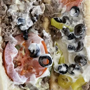 Grand Escape added black olives tomatoes mayo banana peppers