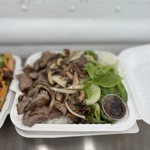 two take out containers of food