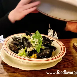 a person holding a plate of food
