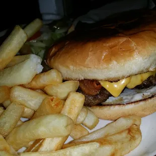 a hamburger and fries on a plate