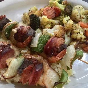 Shish Kabob with beef sirloin, shrimp, sausage,bell pepper &amp; onion.