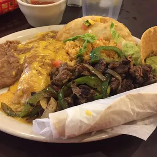 Beef fajita, chicken enchilada, ground beef crispy taco with rice and beans. Exquisite! Very tasty.
