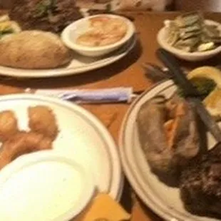 KC strip, Ribeye, sweet potato, baked potato, mixed vegetables, three item appetizer. (Mozzarella sticks, onion rings &amp; breaded mushrooms)