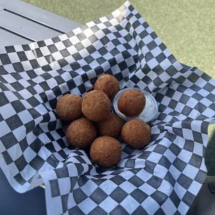 a basket of fried meatballs