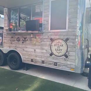 a food truck parked on the side of the road