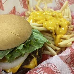 TPL cheeseburger combo, ketchup, mustard , tomato and lettuce, medium cheese fries.
