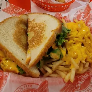 Frisco melt with melted cheese fries
