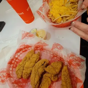 Chicken tender with melted cheese fries