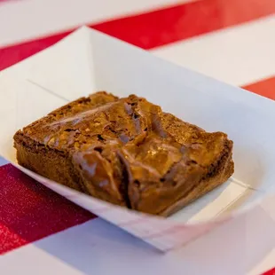 a brownie in a paper container