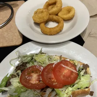 Steak and three cheese sub with onion rings