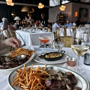 Steak and Frites, cream corn brûlée, and the paper plane cocktail.