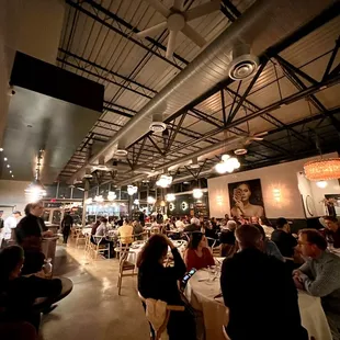 a large group of people eating at a restaurant