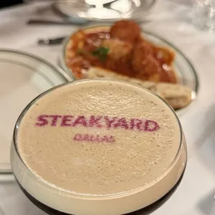 a table with bottles of wine and flowers