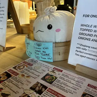 The front with the menu displayed featuring the cutest plush!