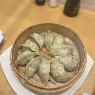 a bowl of dumplings on a table