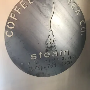 a sign for steam coffee co