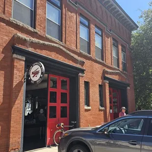 Storefront with firehouse engine-bay doors