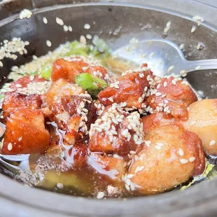 a bowl of food with a spoon in it