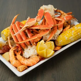 crab legs and corn on a plate