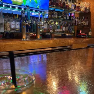 a drink in a glass on a bar