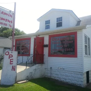 a white house with a red door