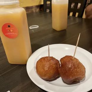 Puff puffs with mango and passion fruit juice.