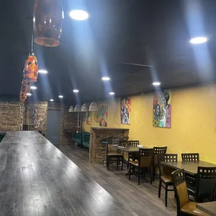 a restaurant with a long table and chairs