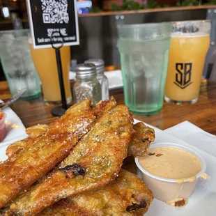 Fried green chile strips w housemade red chile ranch. Mother-in-law of Dragons hazy IPA in the background.