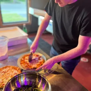 a man making a pizza