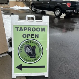 a sign for taproom open