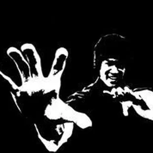 a black and white image of a man with his hands in the air