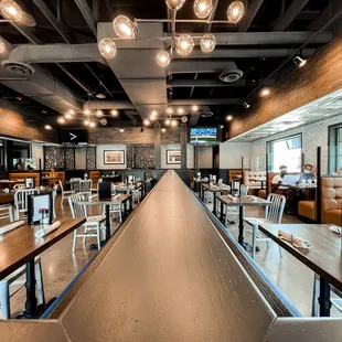 an empty restaurant with tables and chairs