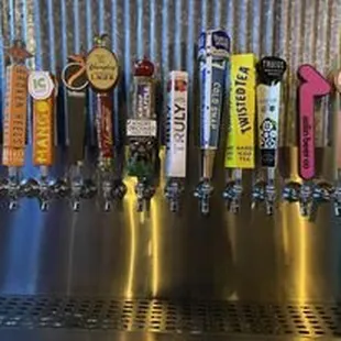a row of beer taps