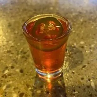 a shot of a drink on a table