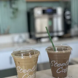 Almond milk latte and soy latte with mocha, both iced