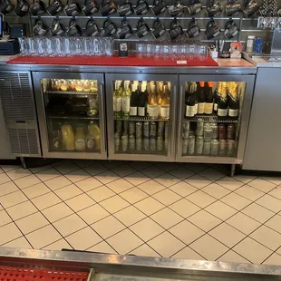 Wine and other drinks behind the bar in main taproom.