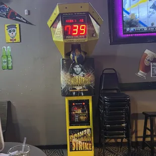 an arcade machine with a clock