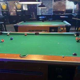 a pool table in a bar